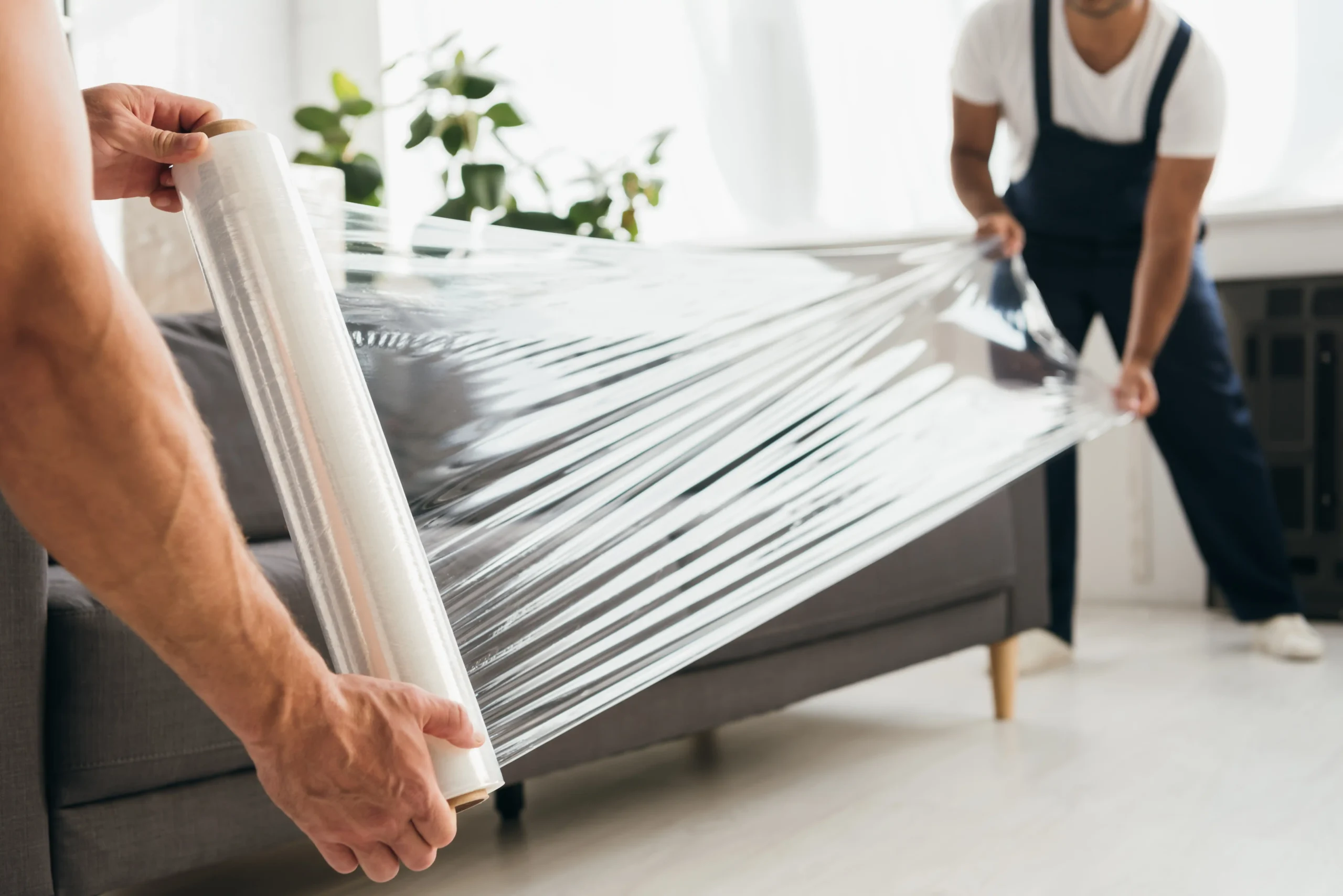 Inicio moving furniture with stretch wrap scaled