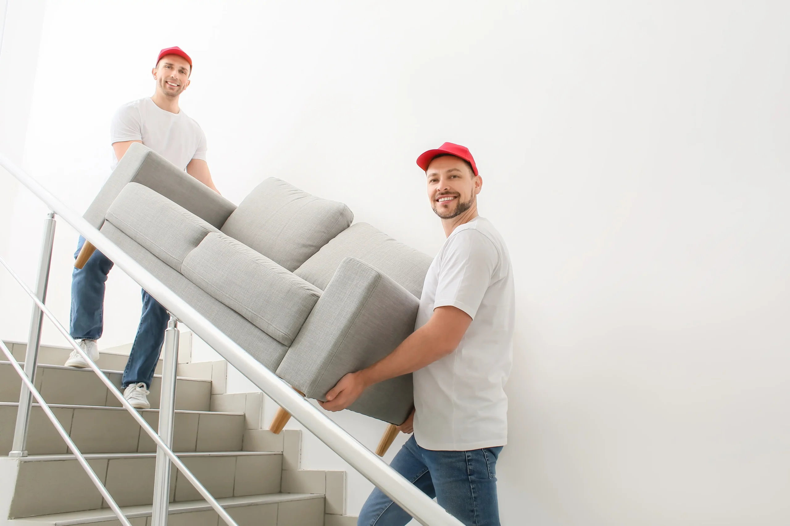 Inicio professional movers carrying sofa 2 scaled